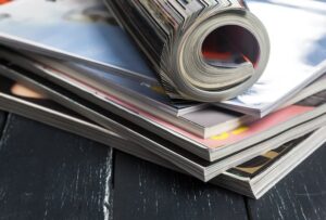 close-up-stacking-magazine-place-on-table-background