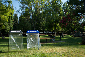 trash bags for event on grass field